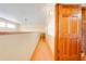 Light hallway with wood floors and access to bathroom at 2801 S Granada Blvd, Kissimmee, FL 34746