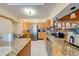 Kitchen with granite countertops and wood cabinets at 2801 S Granada Blvd, Kissimmee, FL 34746