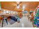 Spacious living area with wood-paneled accent wall and a cozy fireplace at 2801 S Granada Blvd, Kissimmee, FL 34746