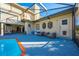 Inviting pool area with patio furniture and a screened enclosure at 2801 S Granada Blvd, Kissimmee, FL 34746