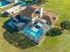 Aerial view of house and large screened pool at 2801 S Granada Blvd, Kissimmee, FL 34746