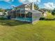 An aerial view of a home with a screened-in pool and hot tub at 2801 S Granada Blvd, Kissimmee, FL 34746