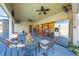 Covered patio with comfortable seating and a stainless steel refrigerator at 2801 S Granada Blvd, Kissimmee, FL 34746