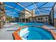 Relaxing pool and spa with brick coping and screened enclosure at 2801 S Granada Blvd, Kissimmee, FL 34746