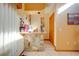 Stone wet bar with wood cabinets and wine storage at 2801 S Granada Blvd, Kissimmee, FL 34746