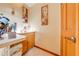Wet bar with stone countertop and wood cabinets at 2801 S Granada Blvd, Kissimmee, FL 34746