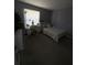 Bright bedroom featuring a bed and workspace by window at 308 Coventry Estates Blvd, Deltona, FL 32725