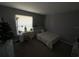 Cozy bedroom with a double bed, desk, and window at 308 Coventry Estates Blvd, Deltona, FL 32725