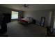 Large bedroom with a king-size bed and plenty of natural light at 308 Coventry Estates Blvd, Deltona, FL 32725