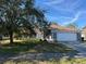 Single-story house with attached garage and well-maintained lawn at 308 Coventry Estates Blvd, Deltona, FL 32725