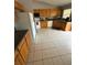 Spacious kitchen with light wood cabinets and tile flooring at 308 Coventry Estates Blvd, Deltona, FL 32725