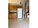 Bright kitchen with wood cabinets and tile flooring at 308 Coventry Estates Blvd, Deltona, FL 32725