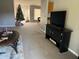 Spacious living room with a view of the Christmas tree and backyard at 308 Coventry Estates Blvd, Deltona, FL 32725