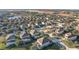 Aerial view of a beautiful community with numerous houses and lush green spaces at 4191 Oaktree Drive, Davenport, FL 33837