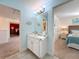 Shared bathroom with single vanity and access to two bedrooms at 4191 Oaktree Drive, Davenport, FL 33837