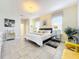 King-size bed, spacious layout, and elegant decor at 4191 Oaktree Drive, Davenport, FL 33837