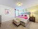 Spacious bedroom with king-size bed and en-suite bathroom at 4191 Oaktree Drive, Davenport, FL 33837