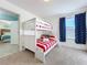 Bedroom with bunk beds and American flag decor at 4191 Oaktree Drive, Davenport, FL 33837