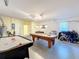 Game room with pool table, air hockey, and foosball at 4191 Oaktree Drive, Davenport, FL 33837