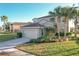 Two-story house with attached garage and landscaping at 4191 Oaktree Drive, Davenport, FL 33837