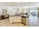 Island kitchen with granite countertops and stainless steel appliances at 4191 Oaktree Drive, Davenport, FL 33837