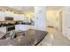Modern kitchen with granite countertops and stainless steel appliances at 4191 Oaktree Drive, Davenport, FL 33837