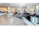 Spacious living room with gray sectional sofa and stylish decor at 4191 Oaktree Drive, Davenport, FL 33837