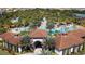 Community resort-style pool with a clubhouse and lush landscaping at 4191 Oaktree Drive, Davenport, FL 33837