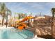 Large orange waterslide at the community pool at 4191 Oaktree Drive, Davenport, FL 33837