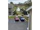 View of parking lot and lake from balcony at 4728 Walden Cir # 37, Orlando, FL 32811