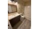Updated bathroom with new vanity, flooring and bathtub at 4728 Walden Cir # 37, Orlando, FL 32811