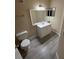 Bathroom with new flooring and white vanity at 4728 Walden Cir # 37, Orlando, FL 32811