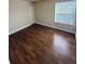 Spacious bedroom with wood-look floors and ample closet space at 4728 Walden Cir # 37, Orlando, FL 32811