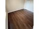 Spacious bedroom with wood-look floors and an ample closet at 4728 Walden Cir # 37, Orlando, FL 32811