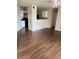 Kitchen with white cabinets and wood-look floors at 4728 Walden Cir # 37, Orlando, FL 32811
