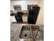 Modern kitchen, featuring granite countertops and black appliances at 4728 Walden Cir # 37, Orlando, FL 32811