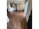 Living room with wood-look floors and access to balcony at 4728 Walden Cir # 37, Orlando, FL 32811