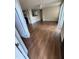 Bright living room with wood-look floors and a ceiling fan at 4728 Walden Cir # 37, Orlando, FL 32811