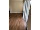 Living room with wood-look floors and access to balcony at 4728 Walden Cir # 37, Orlando, FL 32811