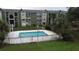 Community swimming pool with surrounding fence at 4728 Walden Cir # 37, Orlando, FL 32811