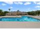 Community pool with spacious deck and surrounding area at 4728 Walden Cir # 37, Orlando, FL 32811