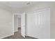 Well-lit bedroom with double doors leading to another room and closet space at 4858 Tribute Trl, Kissimmee, FL 34746