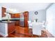 Open concept kitchen with stainless steel appliances and hardwood floors at 4860 Conway Rd # 56, Orlando, FL 32812