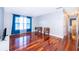 Bright living room with hardwood floors and two accent chairs at 4860 Conway Rd # 56, Orlando, FL 32812