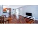 Open living room with hardwood floors and kitchen view at 4860 Conway Rd # 56, Orlando, FL 32812