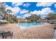 Refreshing community pool with surrounding patio and lounge chairs at 4860 Conway Rd # 56, Orlando, FL 32812