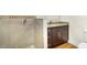 Modern bathroom with granite vanity, tiled shower, and wood-look floors at 4950 Nova Ave, St Cloud, FL 34773