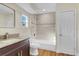 Clean bathroom with granite vanity and bathtub shower combo at 4950 Nova Ave, St Cloud, FL 34773
