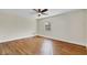Well-lit bedroom featuring wood floors and a window at 4950 Nova Ave, St Cloud, FL 34773