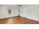 Light-filled bedroom with wood floors and a window with blinds at 4950 Nova Ave, St Cloud, FL 34773